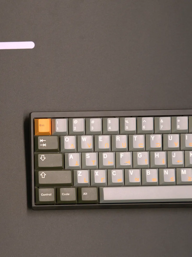 A black Thorix 60% keyboard with an orange Esc key, on the CODE Oblivion deskmat.